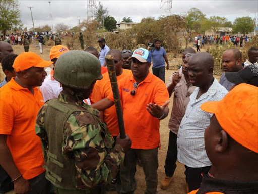 Mombasa Governor Hassan Joho speaks to one of the General Service Unit officers who stopped an ODM rally in Kinango town, Kwale county, on March 23, 2017. /COURTESY