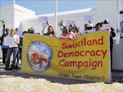 UPROAR:  About 100 Swaziland democracy activists protested outside Parliament yesterday against the R2,4billion 'bailout' loan granted by the South African government to the Swazi government last month. PHOTO: ANNA MAJAVU