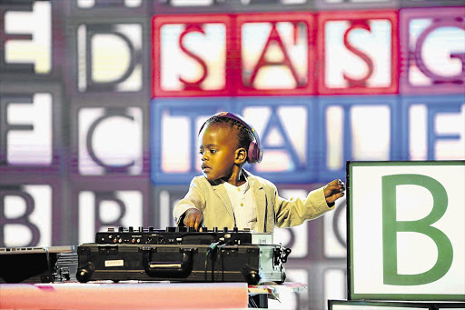 TALKING 'BOUT MY GENERATION: Three-year-old Oratile Hlongwane, known as DJ Arch Jnr, is the youngest DJ in the world, but you won't see him playing in clubs or parties until he has learnt the nine-times table. Oratile won 'SA's Got Talent' over the weekend Picture: e.tv