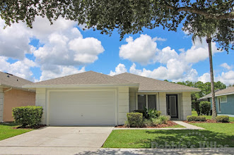 Orlando vacation villa, gated Kissimmee community, games room, west-facing pool with lake view
