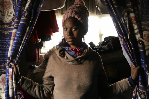 Sinenhlanhla Khanyile stands in front of a room where her younger sister, Nondumiso, was abducted at the weekend allegedly by unknown people who had gained entry to her room. She was found dead on Monday. /Mduduzi Ndzingi