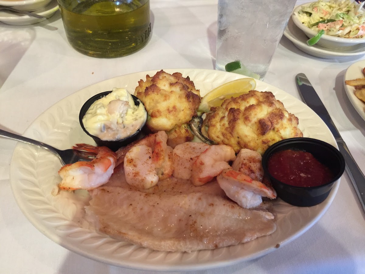 Gluten free seafood platter-fillet, crab cake, scallops, stuffed oyster, shrimp, and sides.  Plus warmed up bread.  Amazing!