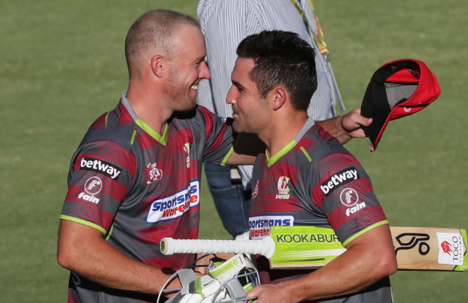 Dean Elgar (R) is congratulated by teammate AB de Villiers (L) after helping the Tshwane Spartans to victory during the Mzansi Super League match against the Jozi Stars at SuperSport Park in Centurion outside Pretoria on November 28 2018.