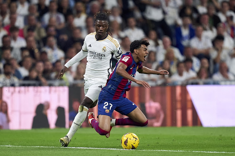 Eduardo Camavinga of Real Madrid CF battles for the ball with Lamine Yamal of FC Barcelona during the LaLiga El Clasico match at Estadio Santiago Bernabeu in Madrid on Sunday night. Picture: Diego Souto/Getty Images