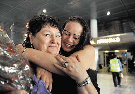 South African drug mule Anneline Mouton greets her mother Estelle Mouton at Cape Town International airport last week after spending more than seven years in a Mauritian prison for possession and trafficking of heroin Picture: LEANNE STANDER/GALLO IMAGES