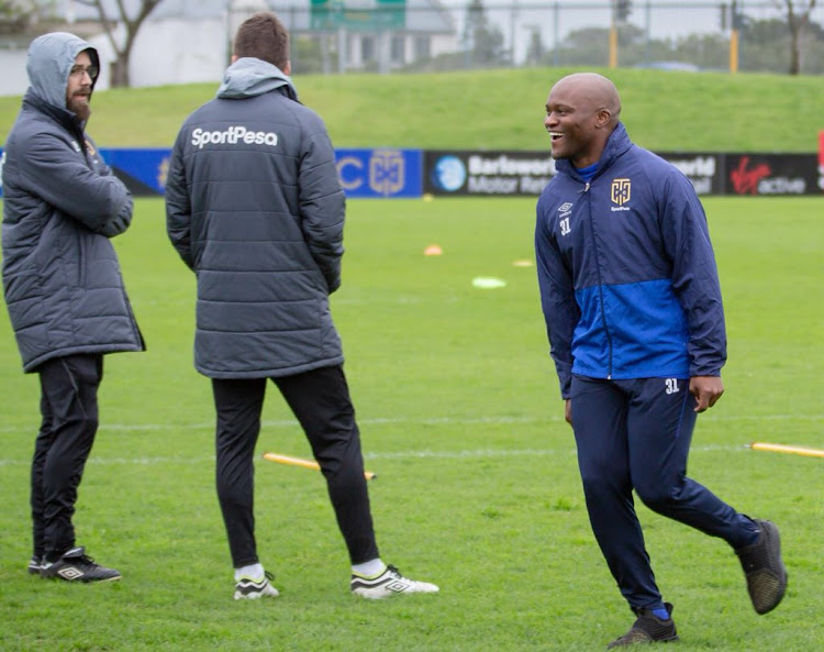 Cape Town City FC striker Tokelo Rantie (R) looks in good spirits during a training session at Hartleyvale in Cape Town on September 12, 2018.