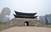 The newly-restored Namdaemun gate, a treasured 14th century historical landmark burned to the ground in an arson attack in 2008, stands in Seoul on April 29, 2013. Thousands of traditional craftsmen were mobilised for five years of elaborate work to restore the gate. The gate will be officially opened on May.