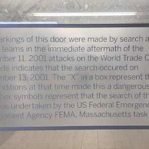 The markings of this door were made by search and rescue teams in the immediate aftermath of the September 11, 2001 attacks on the World Trade Center. The code indicates that the search occured on ...