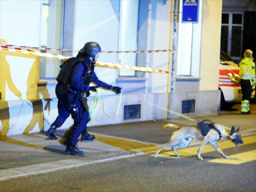 Police stand outside an Islamic center in central Zurich, Switzerland December 19, 2016. REUTERS/Arnd Wiegmann