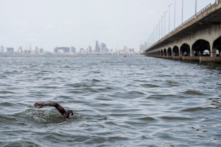 Akinrodoye Samuel swims the 11.8km stretch of the Third Mainland Bridge to raise awareness of suicide and depression, in Lagos, Nigeria, on March 30 2024.
