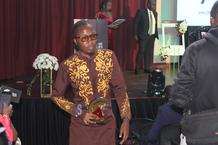 Engagement champion under 30 winner Dickens Luvanda after receiving the award during the Inaugural Content Creator Awards ceremony at the National Museums, Nairobi on April 4, 2024