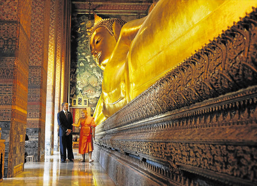 US president Barack Obama visits the Temple of Reclining Buddha at the Wat Pho Royal Monastery in Bangkok, Thailand, yesterday as part of his three-country Asian tour. This is his first international tour since his re-election on November 7, presumably to show he is serious about shifting the US' strategic focus towards the east