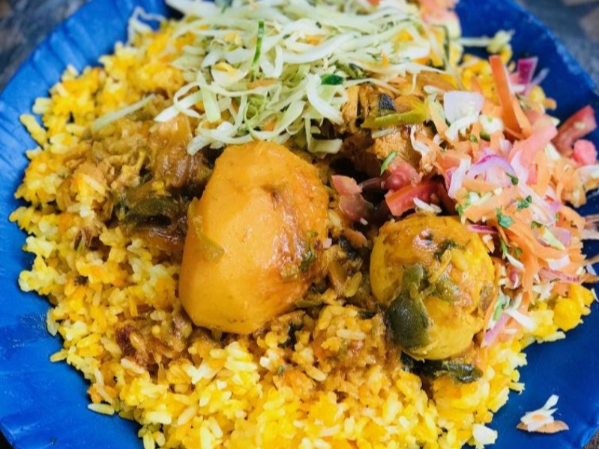 Chicken biriyani served with kachumbari and fresh salad