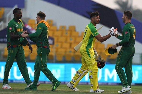 Australia's Marcus Stoinis, second right, shakes hands with SAs Aiden Markram after their ICC Men's T20 World Cup match. CSA has pulled out of the ODI series to Australia in January.