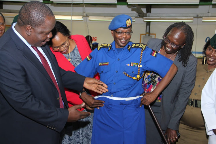 Interior CS Fred Matiang'i with Joseph Boinnet when he visited the NYS camp where police uniforms are being made on Monday, March 25, 2019.