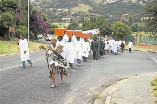 LONG WALK: Members of Shembe Church walk behind Prophet Phakama Shembe in Bassonia, Johannesburg, during the prayers for a peaceful Easter weekend . PHOTO: MOHAU MOFOKENG