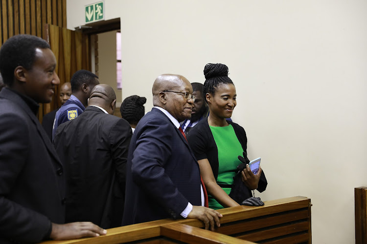 Former president Jacob Zuma and daughter Duduzile, who supported Duduzane during his trial.