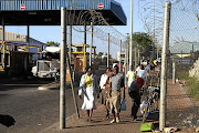 Migrant workers from various African countries pass through Beitbridge on the South Africa-Zimbabwe border on their way home for the Christmas-New Year holiday season.