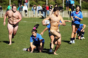 A player makes a run during a nude rugby match between the Nude Blacks (men) and Spanish Conquistadors (women) at Dunedin Rugby Club, Kettle Park on September 10, 2011 in Dunedin, New Zealand