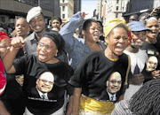 HANDS OFF:  Supporters of then Deputy President Jacob Zuma demonstrate  outside the Johannesburg High Court during his rape trial in 2006. Photo: Tyrone Arthur