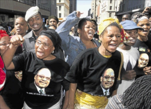 HANDS OFF: Supporters of then Deputy President Jacob Zuma demonstrate outside the Johannesburg High Court during his rape trial in 2006. Photo: Tyrone Arthur