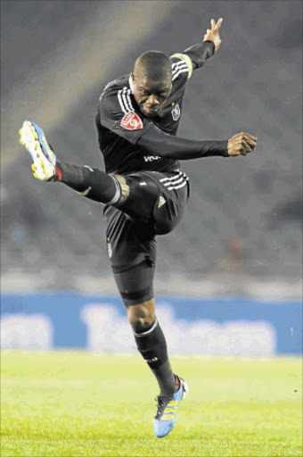 FIRED UP: Orlando Pirates skipper Lucky Lekgwathi releasing a rocket. Photo: Gallo Images