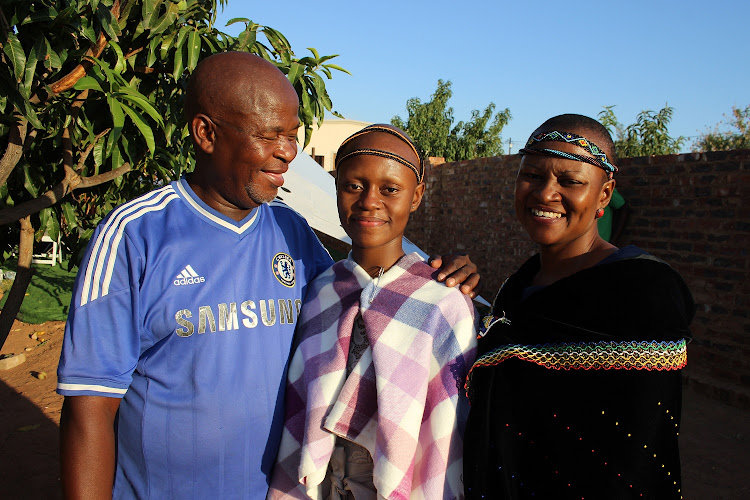 Thokozile poses for pictures with her parents, Monica and January "Mawaza" Kabini.