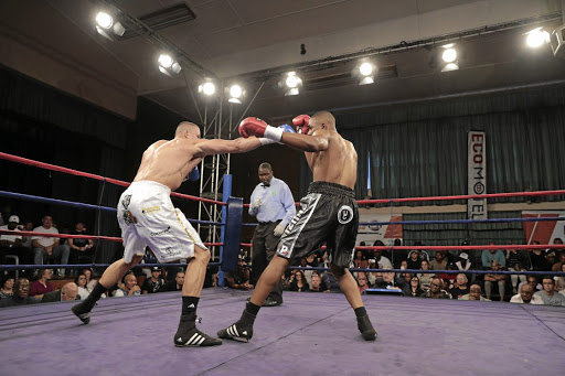 Chris 'The Wolf' Thompson and Akani 'Prime' Phuzi exchange blows during their Gauteng cruiserweight title fight which Phuzi won by a KO in the second round in Randburg on Sunday.