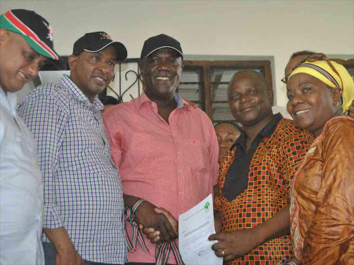 National Assembly Majority leader Aden Duale (second left) and Coast parliamentary group chairman Gideon Mung'aro (Kilifi North MP) congratulate Jubilee candidate Phillip Charo after he was cleared to contest for Malindi MP in the March 7 by-election, February 9, 2016. Photo/ALPHONCE GARI