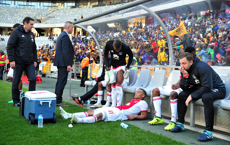 Ajax Cape Town players lie dejected on the bench after the Absa Premiership 2017/18 game against Kaizer Chiefs at Cape Town Stadium on 12 May 2018. Ajax lost 2-1. The Cape side needed a win to avoid playing in the relegation/promotional play-offs against Black Leopards and Jomo Cosmos.