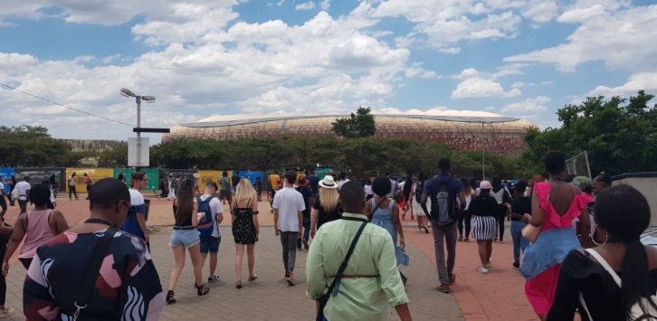 People flock to FNB Stadium in Johannesburg on Sunday for the Global Citizen Festival. Afterwards, late at night, many were left stranded when taxis were not available, Uber apps failed to work and the taxi fares surged.