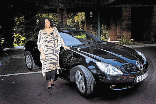 HOT WHEELS: Television executive Thandi Davids is the proud owner of a little black number, a Mercedes-Benz SLK