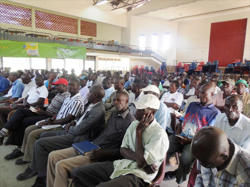 Mumias Sugar Company cane transporters and cane harvesters during a stakeholders' meeting at the Booker Academy hall last year. Photo/File