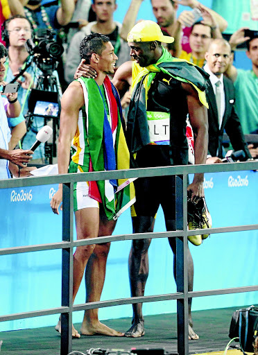 Usain Bolt of Jamaica will be backing friend Wayde van Niekerk this weekend. /Xavier Laine/Getty Images