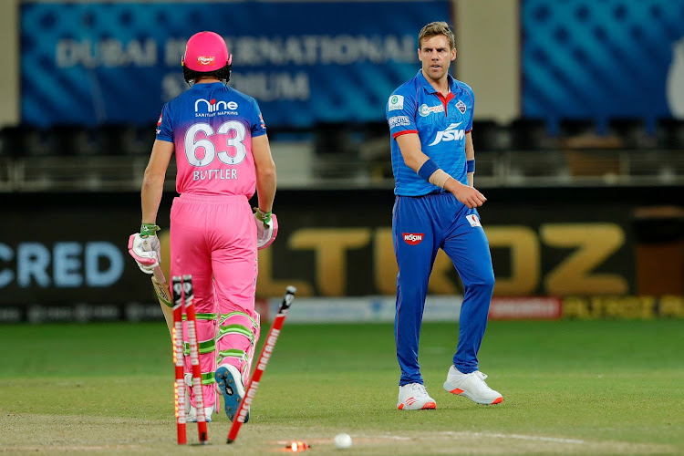 Delhi Capitals fast bowler Anrich Nortje gives Jos Buttler of Rajasthan Royals the hairy eyeball after bowling him with the fastest delivery ever in the IPL at the Dubai International Cricket Stadium, October 14, 2020