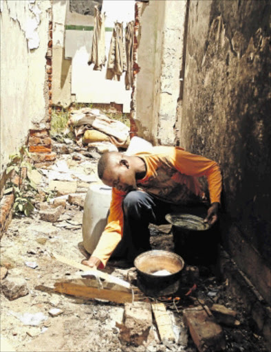 TURFED OUT: Khathutshelo Monyai, who claims he was illegally evicted, now lives in a dilapidated building in Turffontein