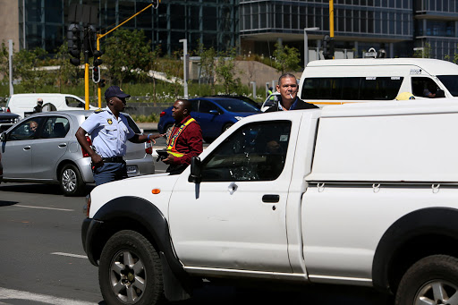 Bullet-proof windows protected the men transporting cash for G4 security from robbers in Rosebank, Johannesburg 1 October 2014. PHOTO: Alon Skuy, The Times