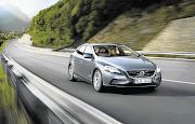 The new Volvo V40 to be unveiled next week and, inset, the high-quality interior