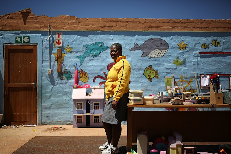 A Grade R teacher poses for a picture inside her damaged class room after a storm in Putfontein, Benoni. The informal community behind the Putfontein Police Station was badly affected by a storm that ripped through parts of Johannesburg on 09 October 2017.