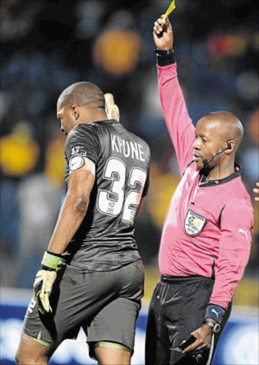 FAILED: PSL referee Buyile Gqubule shows Chiefs skipper Itumeleng Khune the yellow card PHoto: Gallo Images