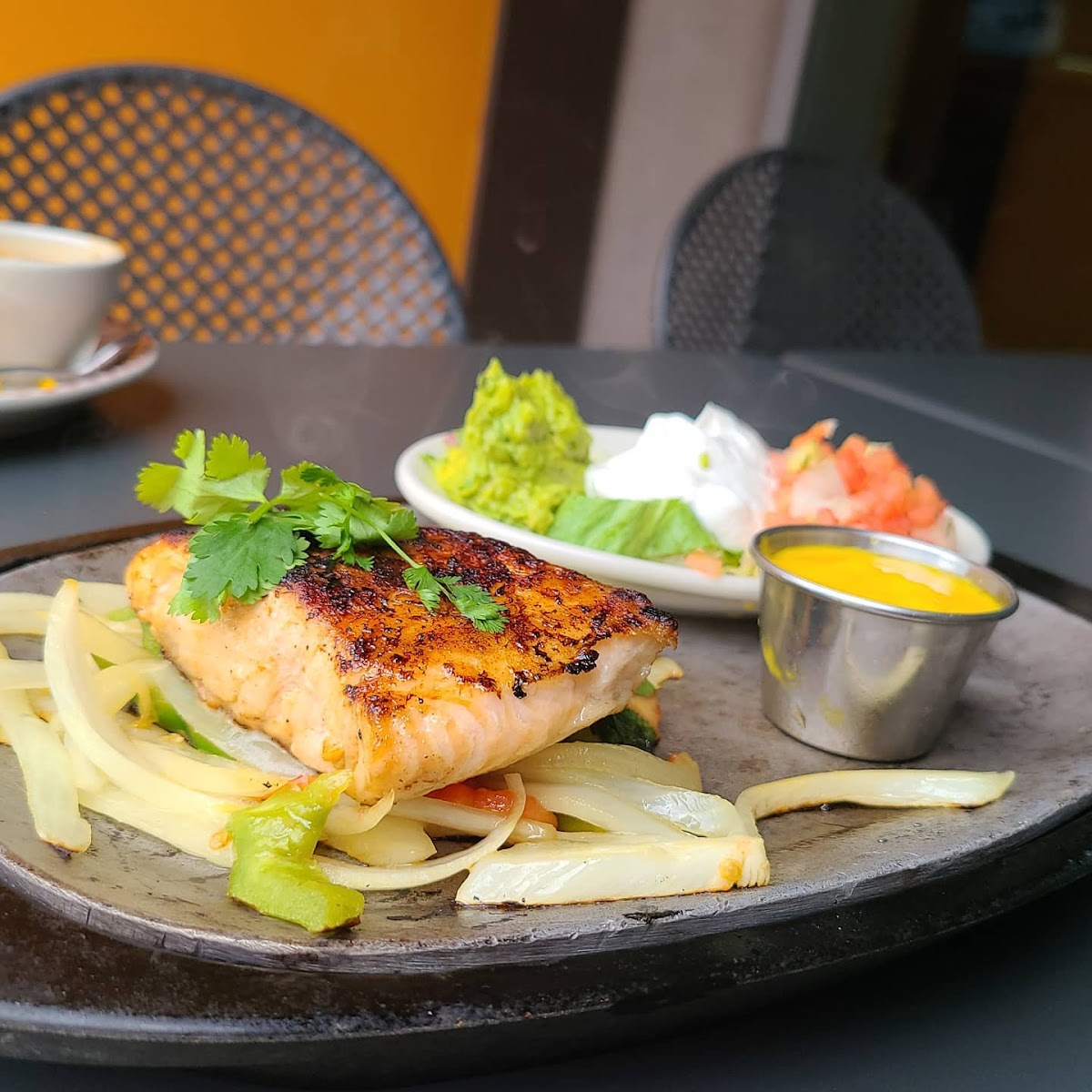 Salmon fajitas served with corn tortillas