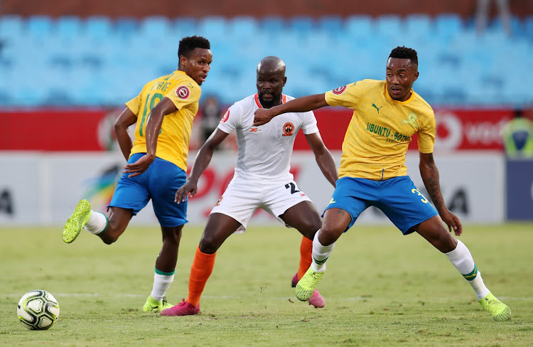 Lebohang Maboe and Themba Zwane of Mamelodi Sundowns challenged by Kenneth Nthatheni of Polokwane City during the Absa Premiership 2019/20 match between Mamelodi Sundowns and Polokwane City at the Loftus Versveld Stadium, Pretoria on the 21 December 2019.