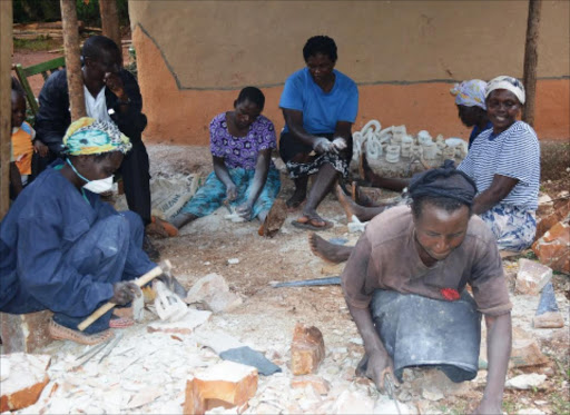 Women carve soapstone bowls, trinkets and figurines in Tabaka.