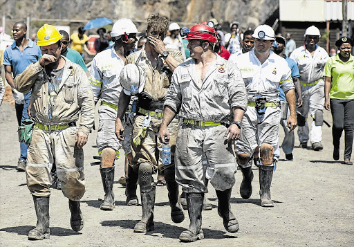 COMING UP FOR AIR: Rescue workers at the Lily mine, near Barberton, where three employees have been trapped under a rockfall for the past 10 days