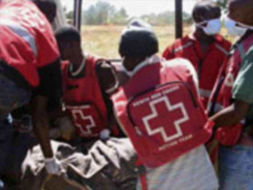 Red Cross workers remove bodies after ethnic violence in Kiambaa Photo/courtesy