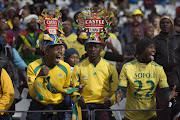 Fans of Bafana Bafana cheer for their team before the start of the friendly football match against Angola at Cape Town Stadium, on June 16, 2015, in Cape Town.