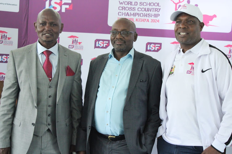 ISF World Cross Country Championship Local Organising Committee CEO Barnaba Korir (C), his deputy Eliud Wambua (L) and KSSSA chairman Kipchumba Maiyo after the p[ress briefing