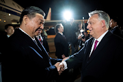 Hungarian Prime Minister Viktor Orban welcomes Chinese President Xi Jinping at the Ferenc Liszt International Airport in Budapest, Hungary, on May 8 2024. 