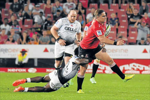 COMEBACK: The Emirates Lions’ Rohan Janse van Rensburg shows his strength against the Cell C Sharks in April. He is set to return to Super Rugby off the bench against the Sharks this afternoon Picture: GALLO IMAGES