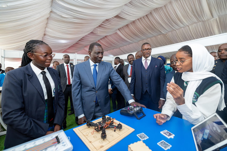 President William Ruto being taken through an exhibition at Uhuru Gardens, Nairobi during the opening of Connected Africa Summit 2024 on April 22, 2024.